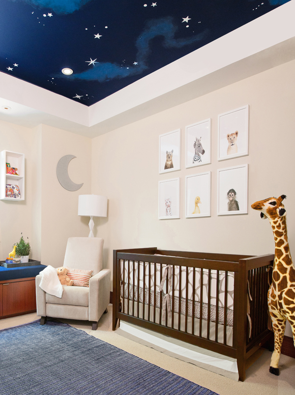 Neutral and blue nursery with night sky painted ceiling