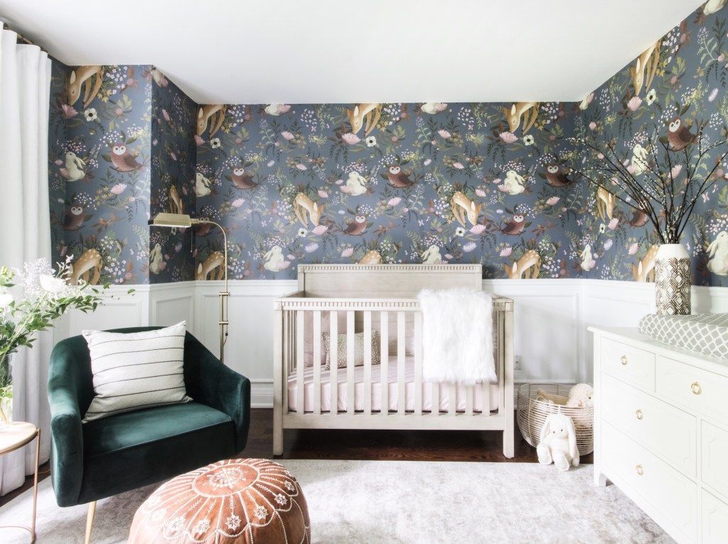 Gender neutral nursery with animal wallpaper