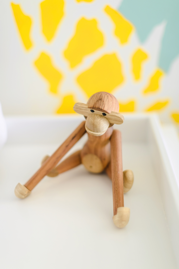 wood-toy-monkey-nursery Colorful Safari Nursery Design by Little Crown Interiors