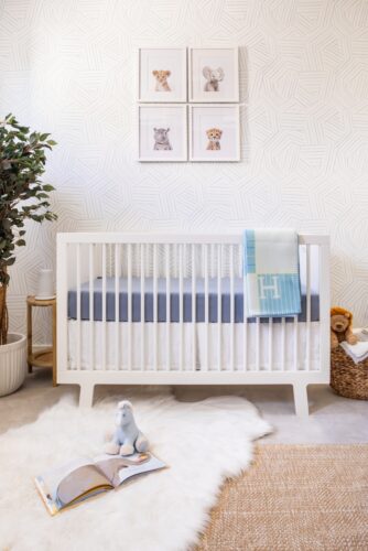 Blue and Neutral Nursery Design with Subtle Blue Wallpaper
