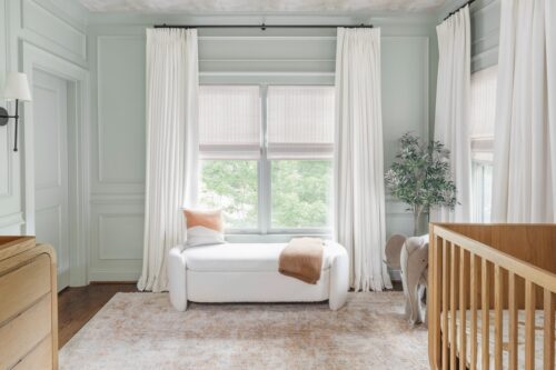 Sage Green Nursery Design with Paneling & Earth Tones